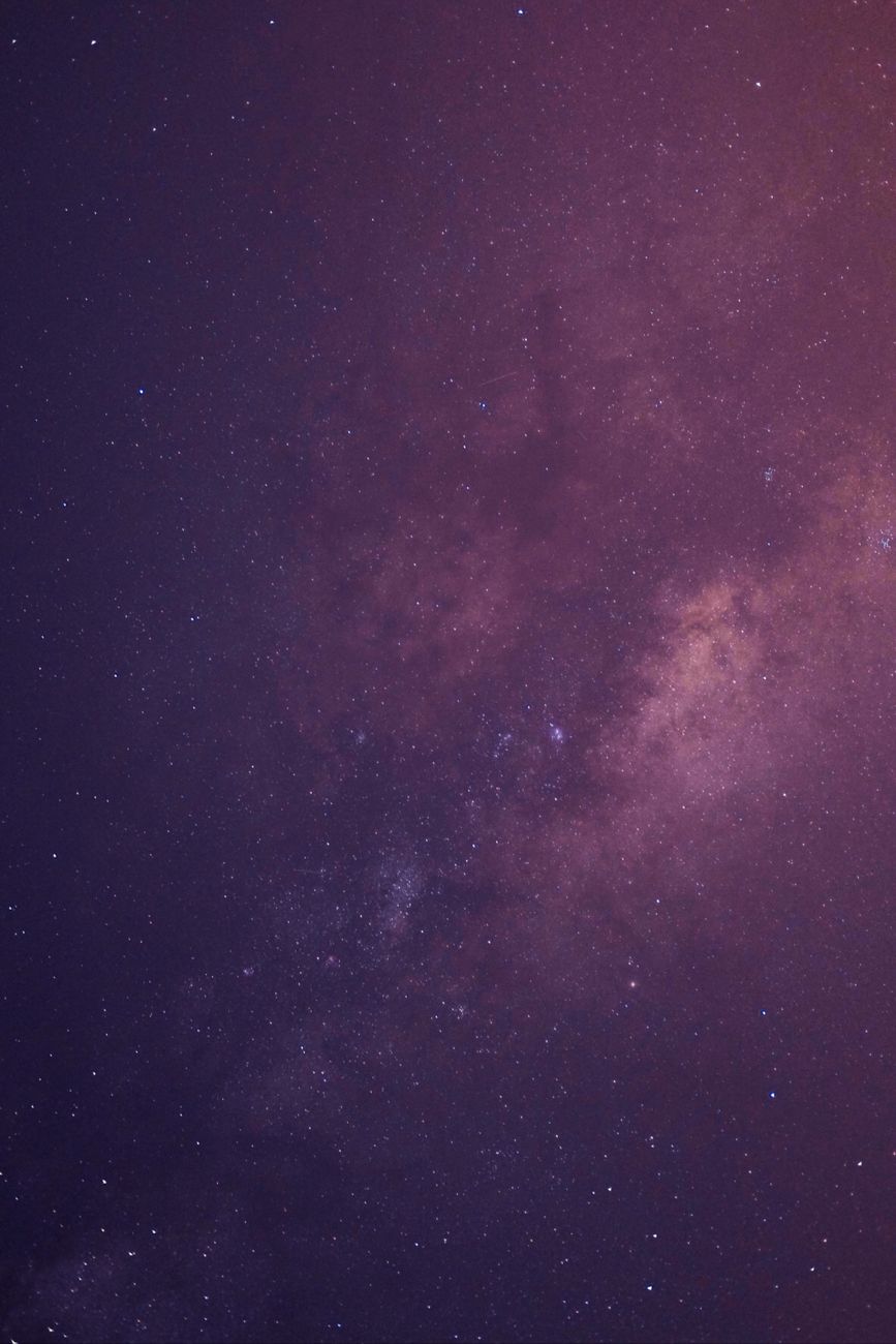 Cosmic pink and purple nebula starfield